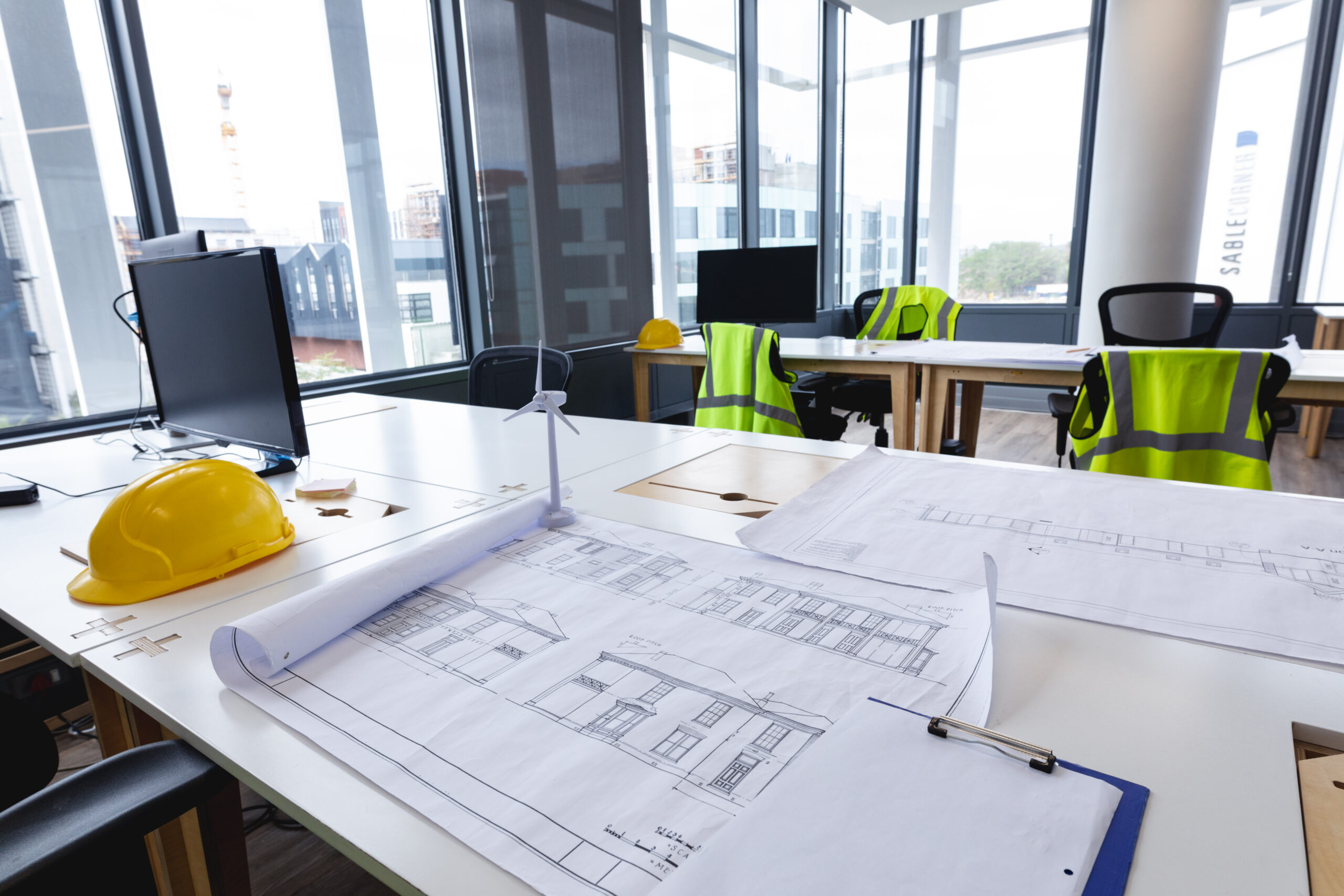Interior of empty modern office with desks computers and drawings. modern office of a creative design business.